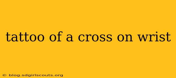 tattoo of a cross on wrist
